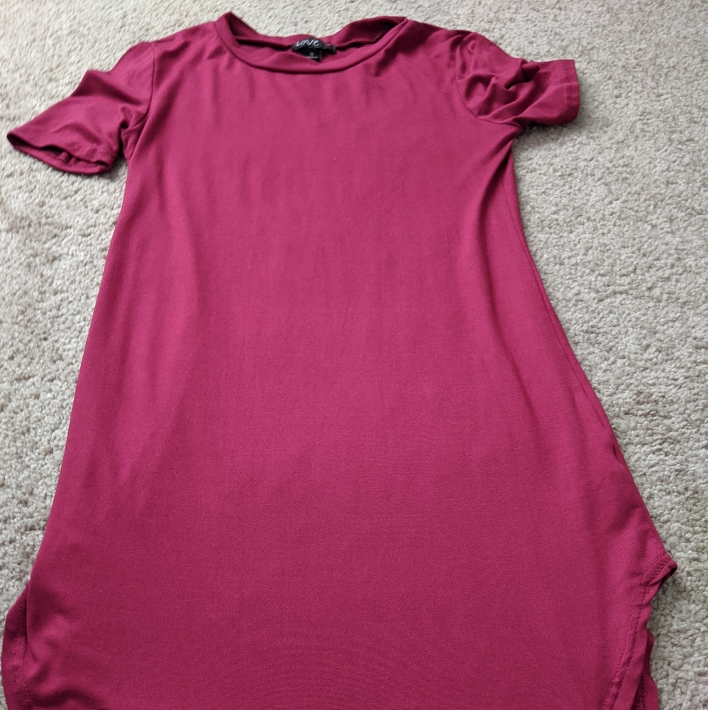 Long burgundy/ red shirt.